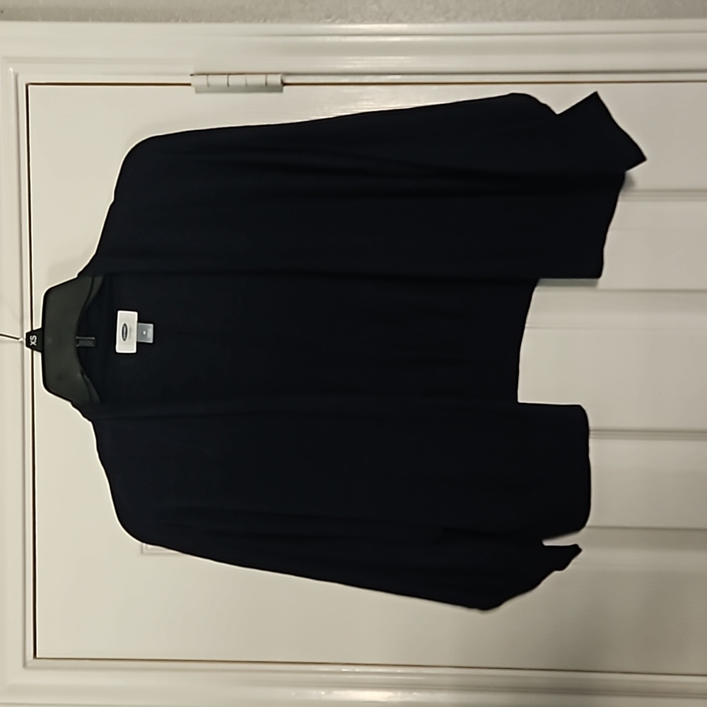 Blue cardigan. It sits at waist